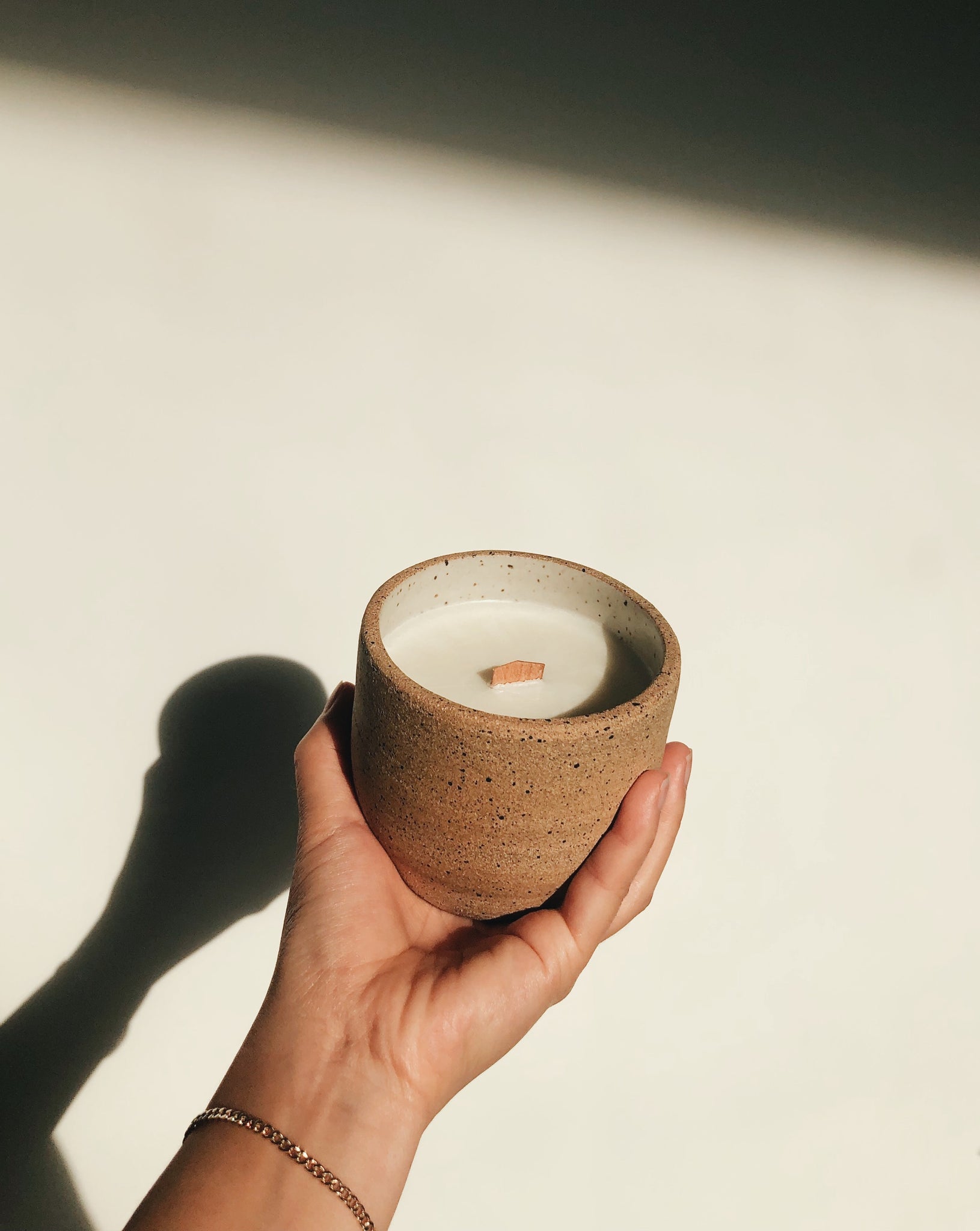 Ceramic candle with raw exterior